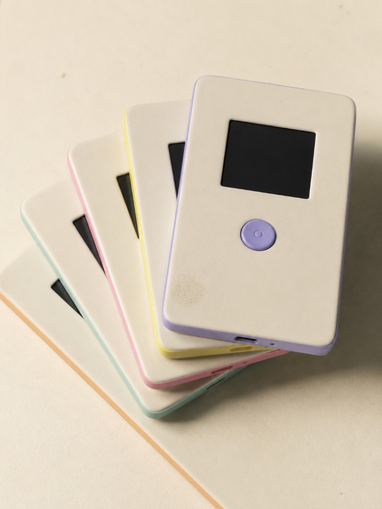 Five Lumo devices fanned out in lavender, yellow, pink, mint and peach